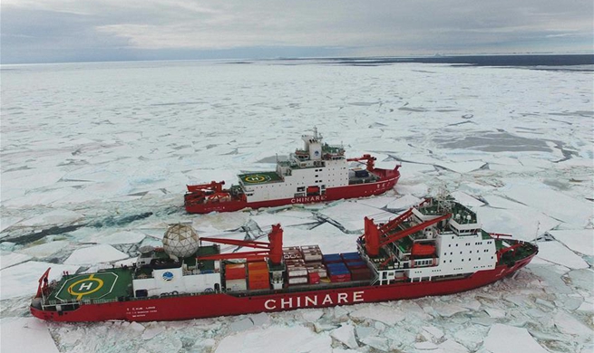 Xuelong and Xuelong 2 sail at new broken-through path in Antarctica