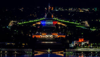 Paris attacks: Australia's Parliament House lit in French colours