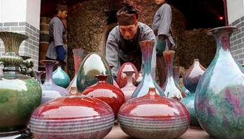 Ceremony taking porcelains out of kiln held in central China