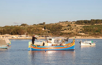 Luzzus seen in fishing village of Marsaxlokk, Malta