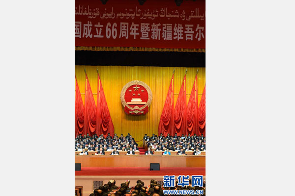 10月1日，慶祝中華人民共和國成立66周年暨新疆維吾爾自治區(qū)成立60周年大會在新疆人民會堂隆重舉行。 新華社記者 高潔 攝 